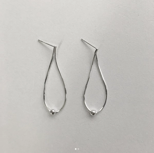 Detailed view of 925 sterling silver drop earrings with chain and polished bead detail