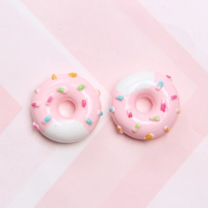 Detailed view of pink resin donuts with colorful sprinkles for DIY craft accessories