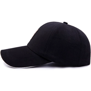 Black cotton baseball cap with a brown leather badge and white contrast sandwich brim