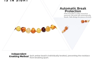Detail of amber baby bracelet with safety screw clasp and individual safety knots