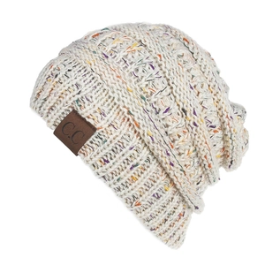 Detail of chunky knit beige beanie with colorful speckles and brown C.C leather patch