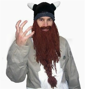 Detail of Viking knitted hat with white horns and brown braided beard for Christmas