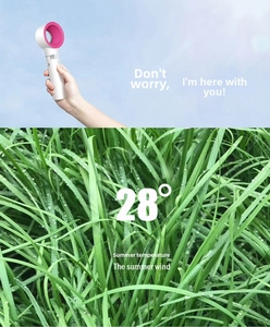 Detailed view of the handheld bladeless fan with minimalist white finish and pink accents