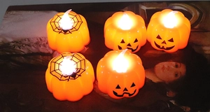 Set of 5 LED Halloween pumpkin lights with spider web and classic ghost face patterns