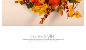 Detailed close-up of artificial autumn maple leaves and berries for Thanksgiving decor