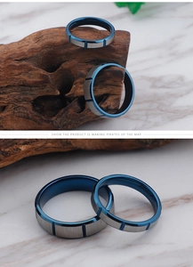 Detail of blue electroplated inner band and brushed silver finish on couple rings