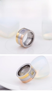 Detailed view of wide tricolor titanium steel ring with inlaid gems and micro diamonds