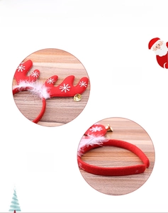 Close-up of red Christmas headband featuring white snowflakes and small gold bells