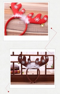 Detail of Christmas reindeer antler headband with white snowflakes and small gold bells