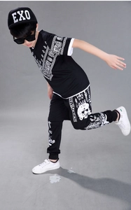 Detail of child streetwear set featuring black cap with white EXO embroidery and patterns