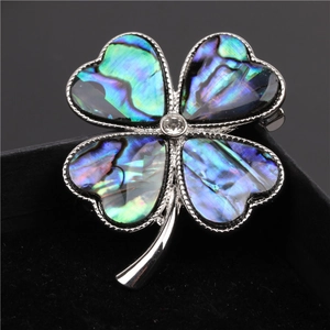 Elegant four-leaf clover brooch with colorful abalone shell and zircon on black velvet