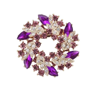 Elegant purple crystal wreath brooch in gold metal with marquise stones and sparkles