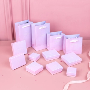 Pink gradient jewelry gift box set with silver foil lettering and satin ribbon handles