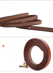 Detailed close-up of brown cowhide belt showing smooth oiled edges and sanded leather back