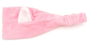 Detail showing plush pink cat ear headband with soft elastic band for face washing