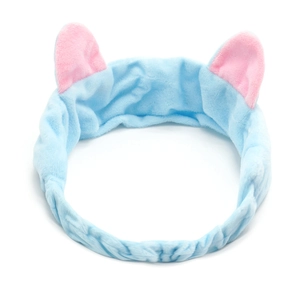 Detail of light blue plush cat ear headband for washing face and makeup routines