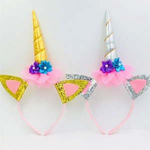 Detailed view of pink unicorn headbands with sequined horns and mesh floral accents