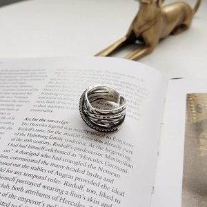 Macro shot of S925 sterling silver vintage layered ring with oxidized finish detail