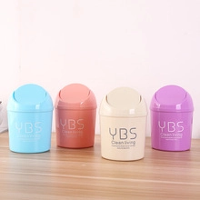 Detailed row of mini plastic desktop bins in blue, pink, beige, and purple pastel colors