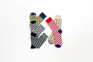 Collection of colorful cotton socks with vibrant geometric, polka dot and mustache patterns