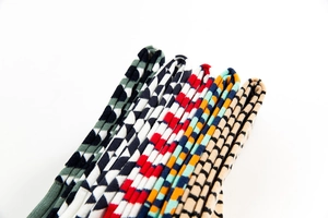 Close-up of colorful patterned cotton socks showing diverse geometric and striped designs