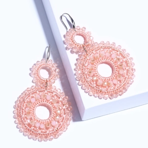 Pink beaded double-hoop drop earrings with handmade woven crystals in a geometric style