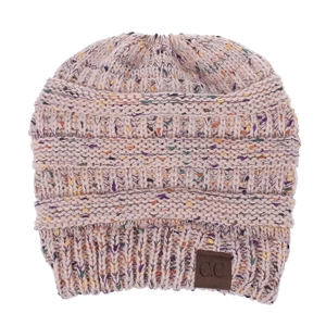 Detailed close-up of mixed color knit beanie with textured stitches and leather logo patch