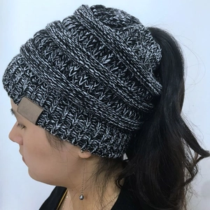 Women's knitted ponytail beanie in grey marl featuring a back opening for hair
