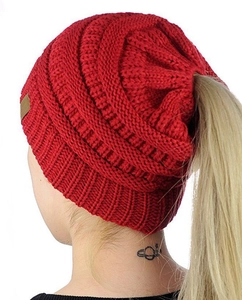 Red knit ponytail beanie detail showing the top opening for hair in winter cold weather