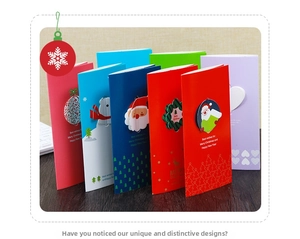 Macro view of 3D Christmas greeting cards with assorted Santa and Reindeer pop-up designs