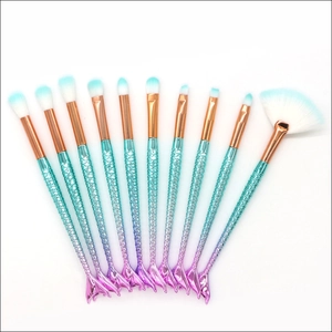 10-piece mermaid makeup brush set with gradient blue-purple handles and soft fiber bristles