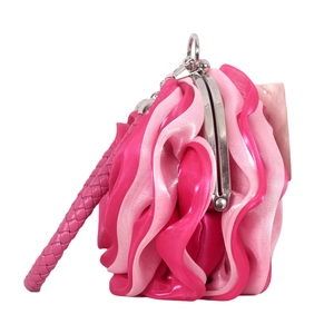 Close-up of pink layered satin floral handbag with silver metal clasp and braided handle