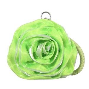 Detail of green silk rose evening bag featuring multi-layer satin petals and metal ring