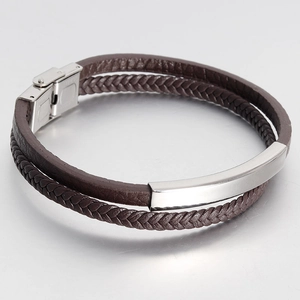 Detail of brown double-layer leather bracelet with silver steel plate and snap clasp