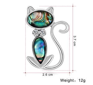 Detailed view of silver cat brooch with abalone shell inlay and 3.7cm height label
