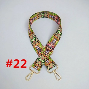 Detail of bohemian ethnic pattern woven strap with adjustable gold metal lobster clasps