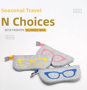 Three multi-colored felt eyeglasses cases with zippers and carry loops in a close-up view