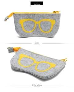 Detail of light gray felt glasses case with yellow zipper and eye-catching glass pattern