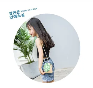 Cute snail-shaped crossbody bag for girls featuring a vibrant green spiral pattern detail