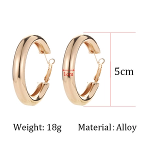 Detail view of large 5cm gold alloy hoop earrings showing 1cm thickness and 18g weight