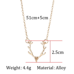 Detail shot of golden reindeer antler necklace with 51+5cm chain length and 2.5cm pendant