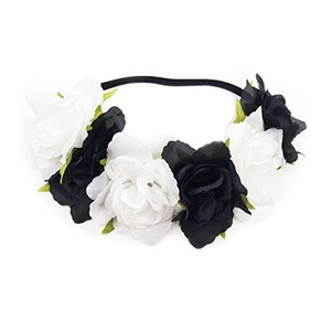 Detailed view of elastic headband with realistic black and white fabric rose flowers