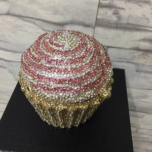Detailed close-up of cupcake-shaped evening bag with pink and white crystal rhinestones