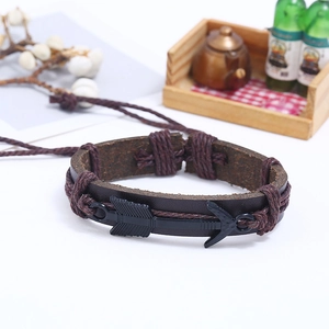 Men's woven dark brown leather bracelet featuring a black metal arrow charm and rope accents
