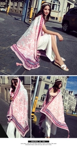 Close-up of pink and white floral cotton linen scarf with elegant fringe detail