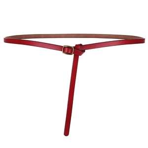 Minimalist red leather skinny belt for women with a vintage bronze pin buckle on white back