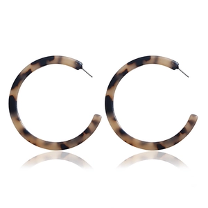 Classic tortoiseshell acrylic C-shaped hoop earrings with a polished finish and reflections