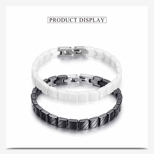 Detail view of 7mm ceramic bracelets in black and white with metal folding clasps