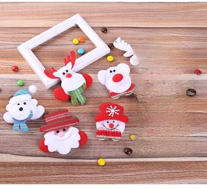 Detailed set of Christmas LED plush brooches featuring Santa, snowman and reindeer figures