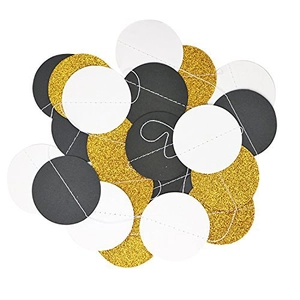 Detail of glitter gold, matte black and white paper circle garland for party decor